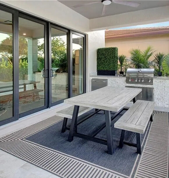 Custom outdoor kitchen with Bull grill and stainless steel appliances in Cascata at MiraLago